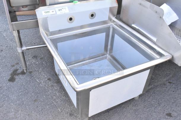 Brand new Regency 600S12424 stainless steel single bay sink, no legs, scratch and dent, NSF certified label visible.