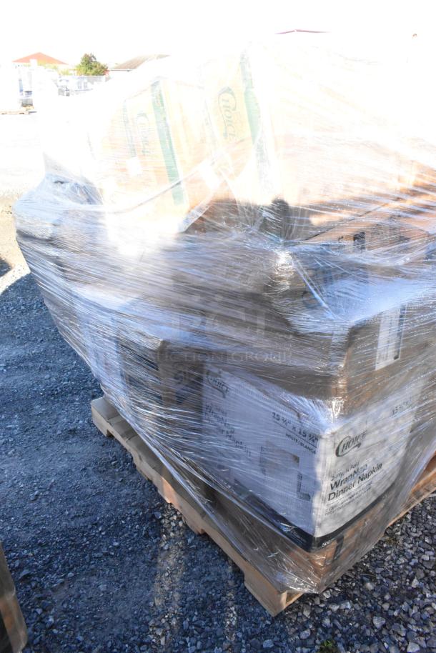 Pallet wrapped in plastic containing new scratch and dent items, including cold cups and dinner napkins, ready for auction sale.