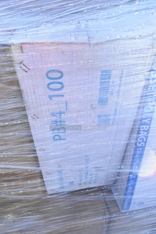 Pallet with wrapped boxes labeled "PB#4 100" and "Ekay Plastic." Contains scratch and dent cold cups, towels, baking cups.