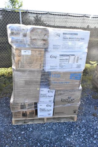 Pallet of 27 new scratch and dent items including toilet rolls, plastic cutlery, food trays, and more, wrapped in plastic.
