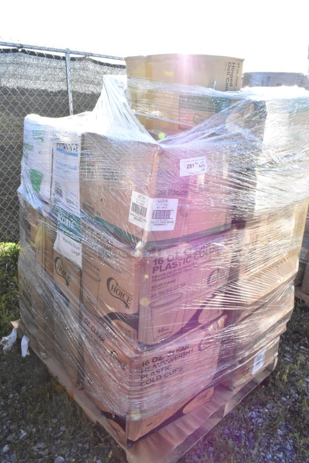 Pallet of 28 new scratch and dent items wrapped in plastic, including gloves, trash bags, cups, containers, and napkins.