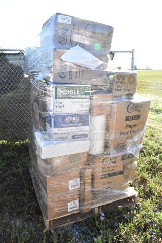 Pallet of 36 new scratch and dent items, including Noble gloves, Choice paper plates, and hot cups, encased in plastic wrap.