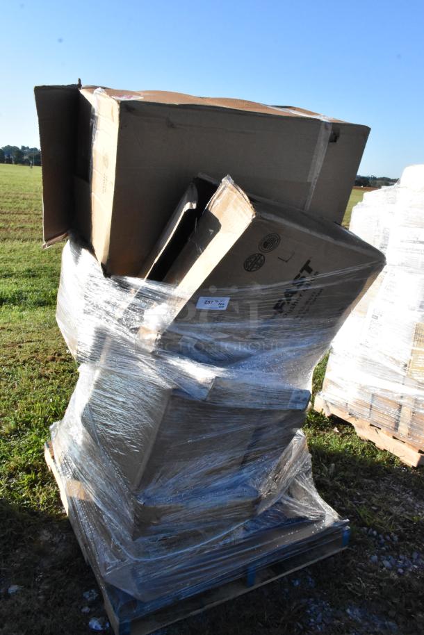 Shrink-wrapped pallet of 20 new scratch and dent items, including organizer bin, mop bucket, trays, and more, in cardboard boxes.