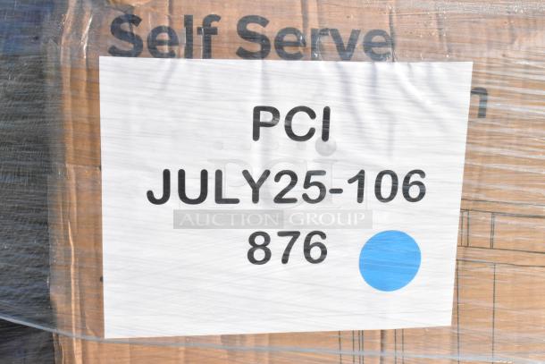Label on a pallet with "PCI JULY25-106 876" in bold text, indicating auction details. Wrapping covers cardboard boxes.