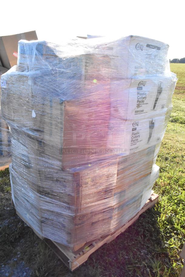 Pallet of assorted items including trash bags, paper towels, deli containers, and cups. Wrapped in plastic, boxes slightly scratched.