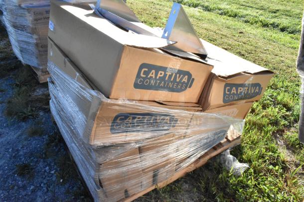 Stack of Captiva Containers boxes on a pallet, wrapped in plastic. Boxes contain 11 scratch and dent items including a stainless steel wall shelf and poly bottles.