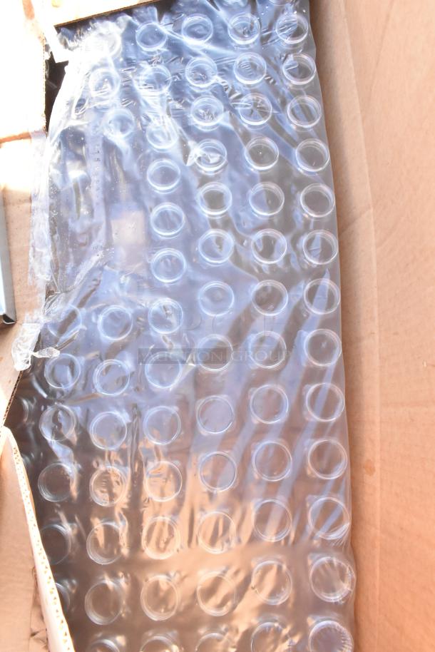 Box containing poly bottles with protective packaging and a stainless steel wall shelf. Brand new, scratch and dent items.