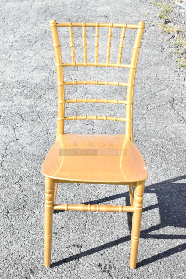 23 new Lancaster Table & Seating gold resin Chiavari chairs, scratch and dent, elegant design, durable construction.