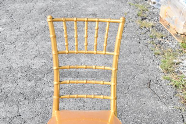 Gold Resin Chiavari Chair by Lancaster Table & Seating, scratch and dent condition, elegant gold finish, lattice back design.