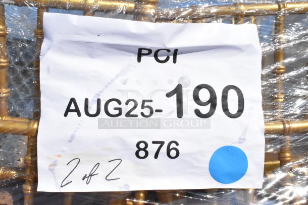 23 new Lancaster Table & Seating gold resin Chiavari chairs, scratch and dent, wrapped with auction label "AUG25-190".