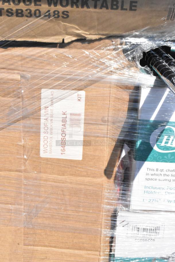 Items in packaging, including stainless steel tables, Waterloo sinks, and a bar stool. Labels show product codes and descriptions.