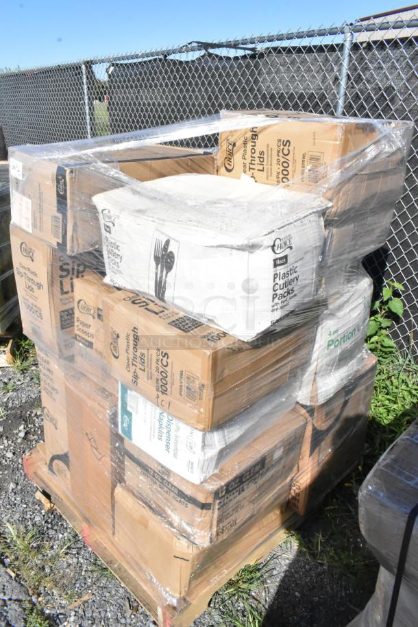 Pallet of boxed items including cold cups, plastic cutlery, and portion cups, wrapped in plastic. Scratch and dent condition.