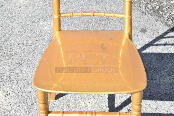 Brand new Lancaster Table & Seating gold resin Chiavari chair. Scratch and dent condition. Molded seat, bamboo-style legs.