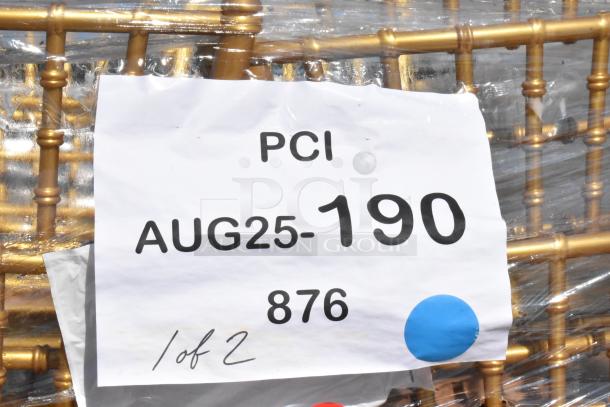 Alt text: Gold resin Chiavari chairs wrapped in plastic, with a label reading "PCI AUG25-190 876 1 of 2."