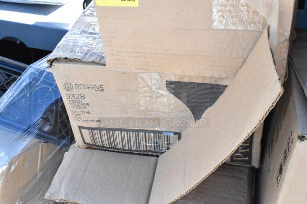 Cardboard box with "Reserve by Libbey" branding, marked 9328, indicating 1 dozen 6 oz coupe glasses. Box is slightly damaged.