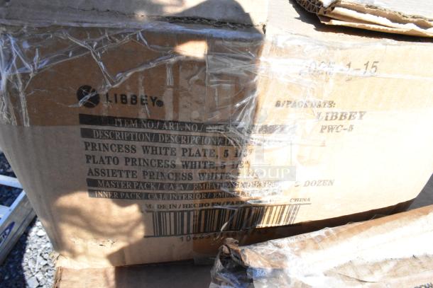 Brown box with "Libbey" branding, labeled for "Princess White Plate" packed in dozen, partially sealed with plastic wrap.