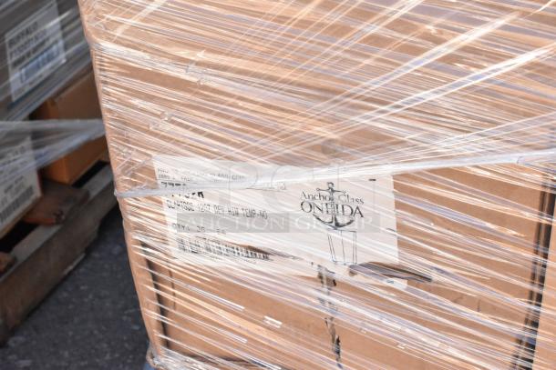 Plastic-wrapped pallet of Anchor Glass by Oneida. Contains 60 brand new, scratch and dent glassware items. Labels visible.