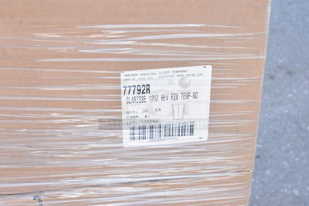 Cardboard box wrapped in plastic, labeled "Anchor Hocking Glass Company," containing 36 Clarisse 12 oz. glassware. Lot 170204.