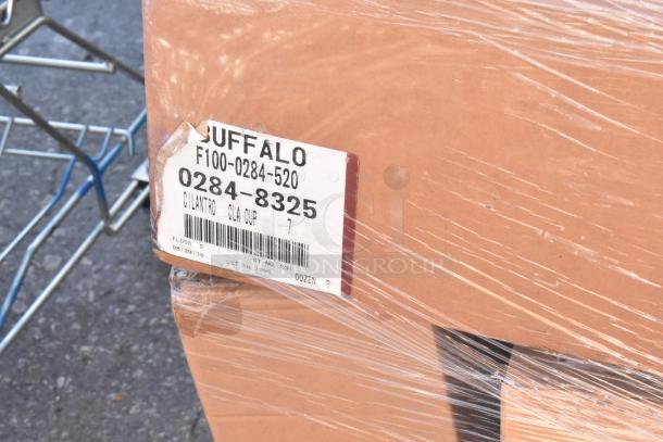 Box with "Buffalo" label containing scratch and dent dishware. Labels indicate product and batch details.