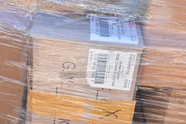 Plastic-wrapped boxes labeled "Buffalo Cream Undec. CMW Plate 6 1/4 In, Made in China." Contains scratch and dent dishware.