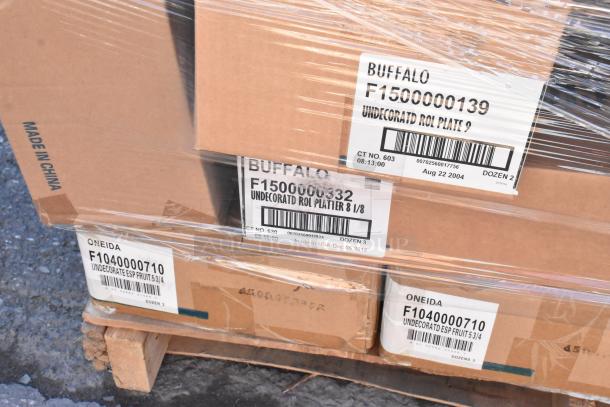 Boxes of Oneida and Buffalo dishware, new scratch and dent condition, labeled with model numbers F1040000710 and F1500000139, on pallet.
