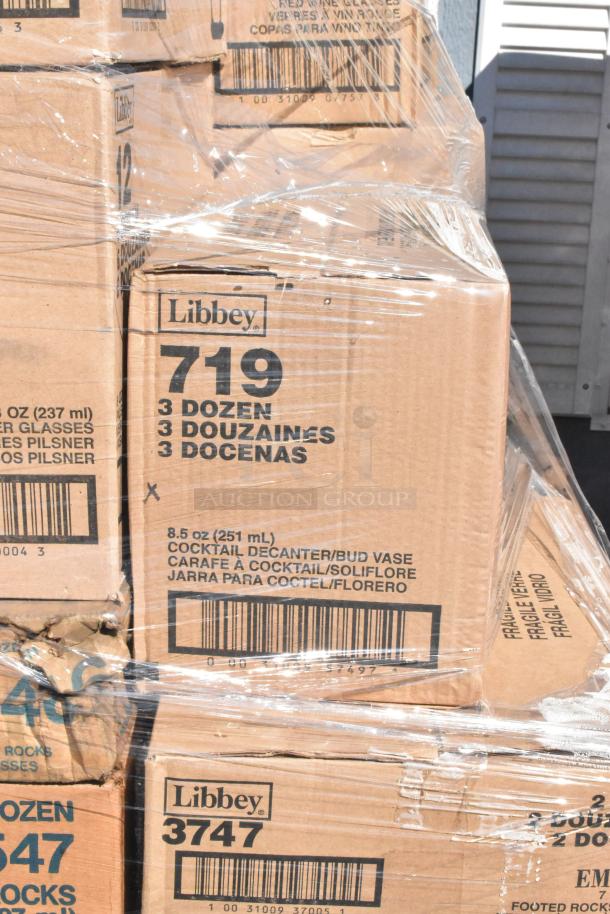 Sealed boxes of Libbey glassware, labeled "719" and "3747," each containing 3 dozen cocktail decanters and bud vases.
