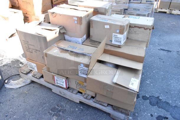Boxes of brand new "scratch and dent" dishware on pallet, various labels include "Oneida" and "Buffalo." 16 items.