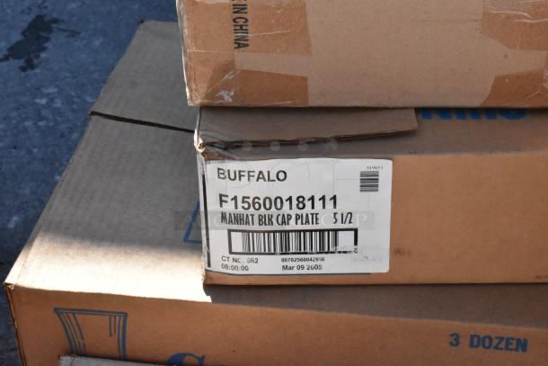 Cardboard boxes labeled "Buffalo F1560018111 Manhat Blk Cap Plate 5 1/2," indicating dishware set. New, scratch and dent condition.