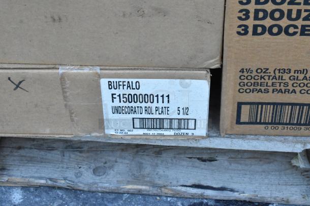 Cardboard box labeled "BUFFALO F1500000111 UNDECORATED ROL PLATE 5 1/2," containing new dishware. Scratch and dent sale.