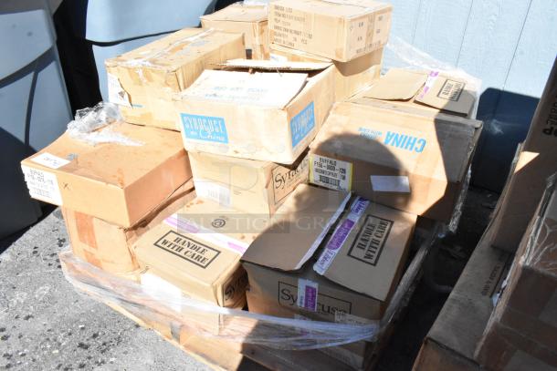 Stack of 22 boxes labeled "Syracuse China," "Handle with Care." Contains new scratch-and-dent dishware on a pallet.