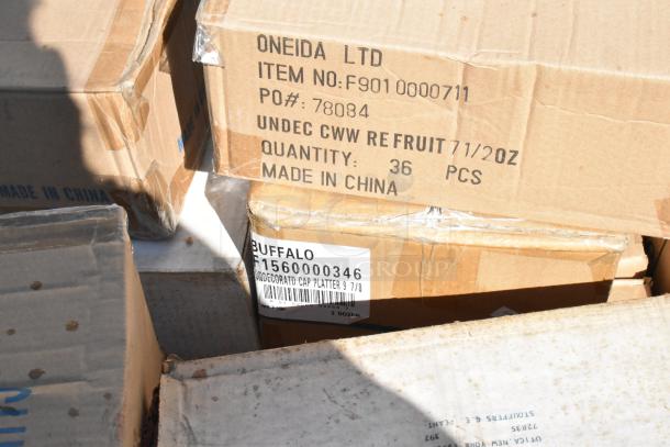 Cardboard boxes containing brand new scratch and dent dishware. Labels read "Oneida LTD" and "Buffalo." Made in China.