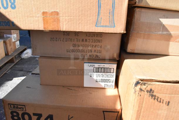 Cardboard boxes labeled "Libbey" and "Oneida" stacked, containing various brand new scratch and dent dishware.