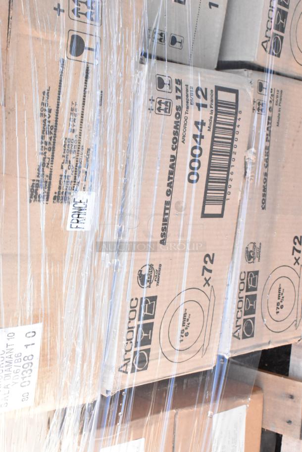 Boxes of Arcroc dishware wrapped in plastic, labeled as "Assiette Gateau Cosmo 175" and "Made in France," visible markings.