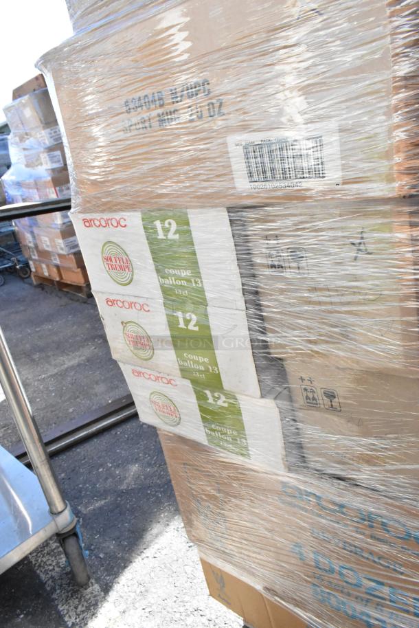 Pallet with 42 boxes of scratch and dent dishware, brand Arcroc, visible labels for 12 coupe ballon glasses.