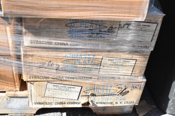 Stack of boxes with Syracuse China Corporation labels, containing new scratch and dent dishware/glassware. 52 items total.