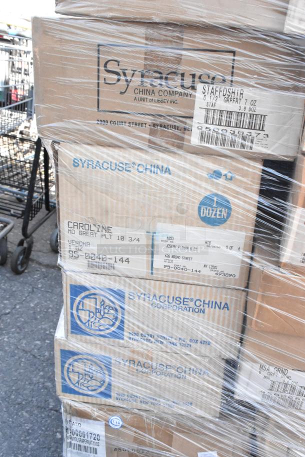 Boxes of Syracuse China dishware, wrapped in plastic. Includes Staffosher, Caroline plates, 12 pieces per box. Scratch and dent condition.