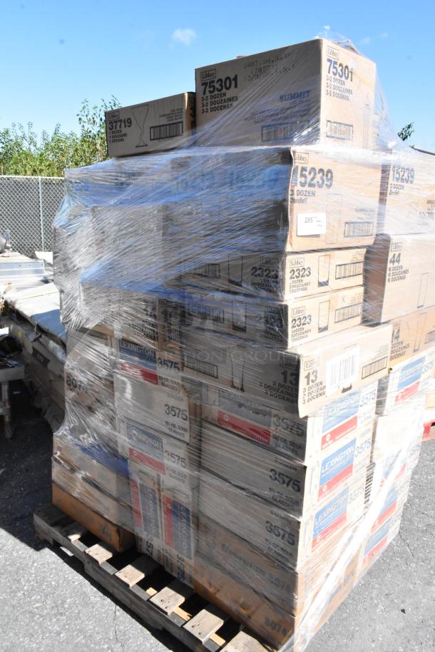 Pallet of 54 boxes of assorted glassware, wrapped in plastic. Boxes labeled Libbey with various product codes. Scratch and dent condition.
