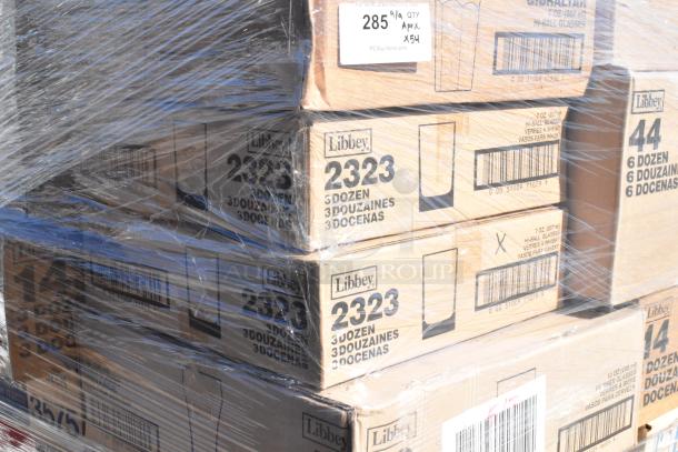 Pallet wrapped with boxes of Libbey glassware, model 2323. Labels read "3 dozen" and state "scratch and dent".