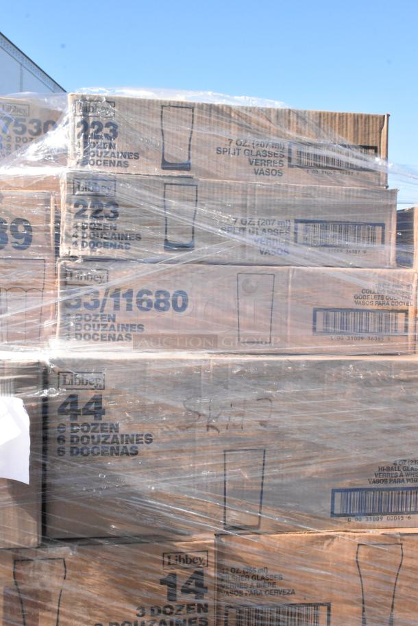 Boxes of Libbey glassware, labeled with quantities and styles, wrapped in plastic. Scratch and dent condition.