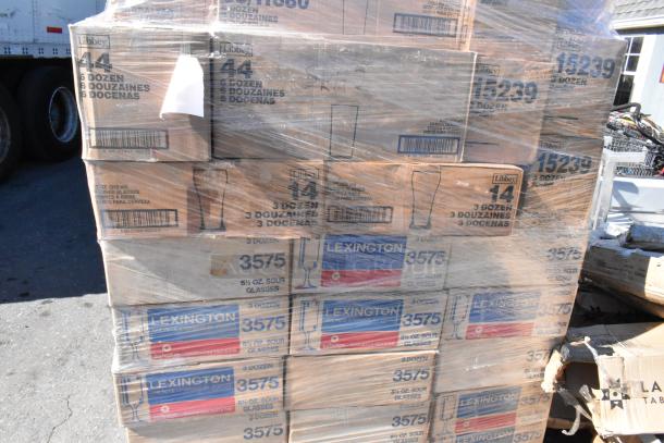 Pallet of boxed glassware including Libbey and Lexington brands, new scratch and dent condition, various sizes and models.