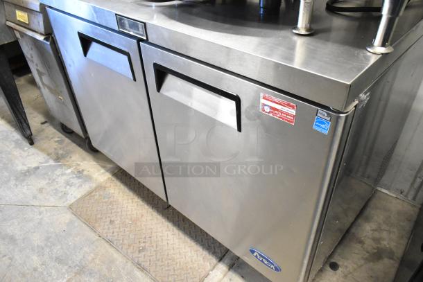 2017 Atosa MGF8402GR stainless steel 2-door undercounter cooler on casters, 115V, 1 phase, commercial label visible.