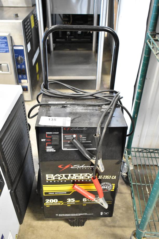 BRAND NEW SCRATCH AND DENT! Schumacher SE-2352-CA Battery Charger, 200A engine start, 35A boost, 6A charge/maintain, minor cosmetic damage.