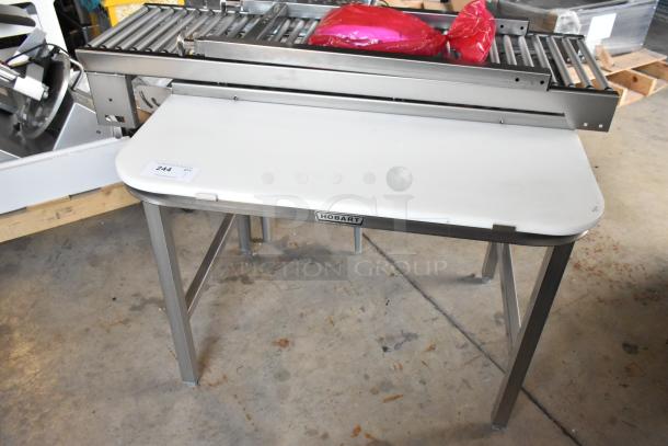 Hobart HRT5 stainless steel commercial roller conveyor wrapping station, used, includes NIB conveyors, model label visible.