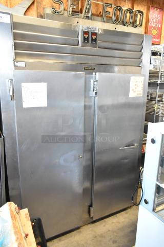 Traulsen AD232W-ZAB27 stainless steel commercial 2-door reach-in cooler and freezer. Doors need attachment. 115 volts, 1 phase.