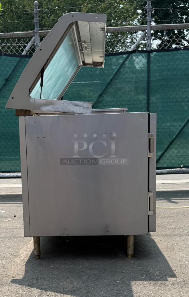 HEATCRAFT Refrigerator Unit, Model RAMK23AG, stainless steel, hinged top, exterior fair condition, auction group marking visible.