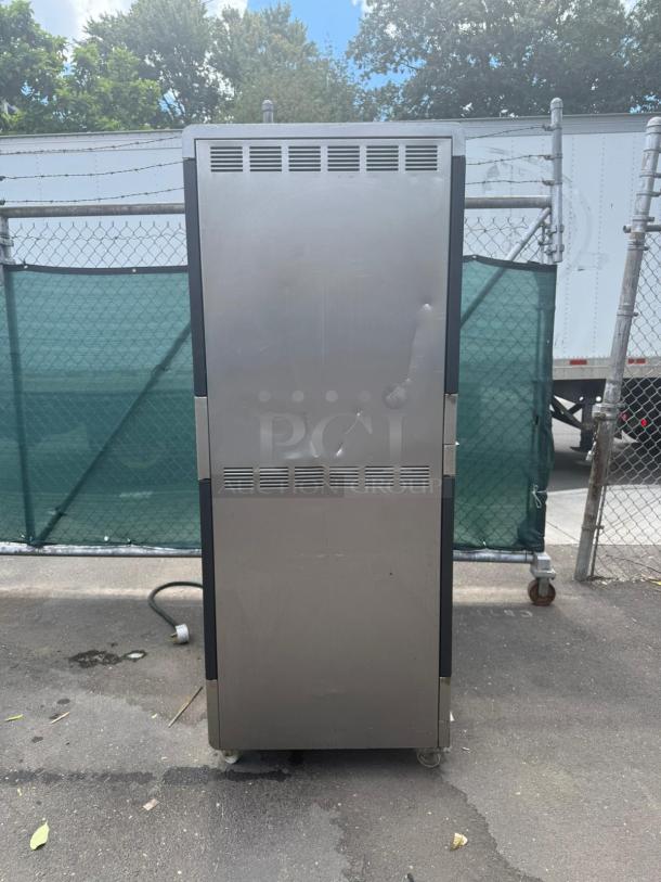 HOBART Electric Rotisserie Oven HRW 303, stainless steel, visible wear, exterior view, caster wheels, electrical cord.