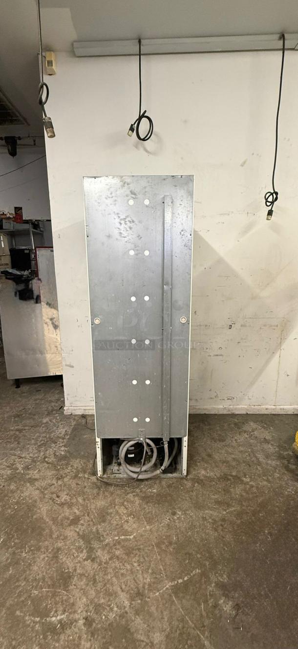Master-Bilt Coca-Cola commercial cooler merchandiser, 1 glass door, model merchandiser, visible wear, back view shown.