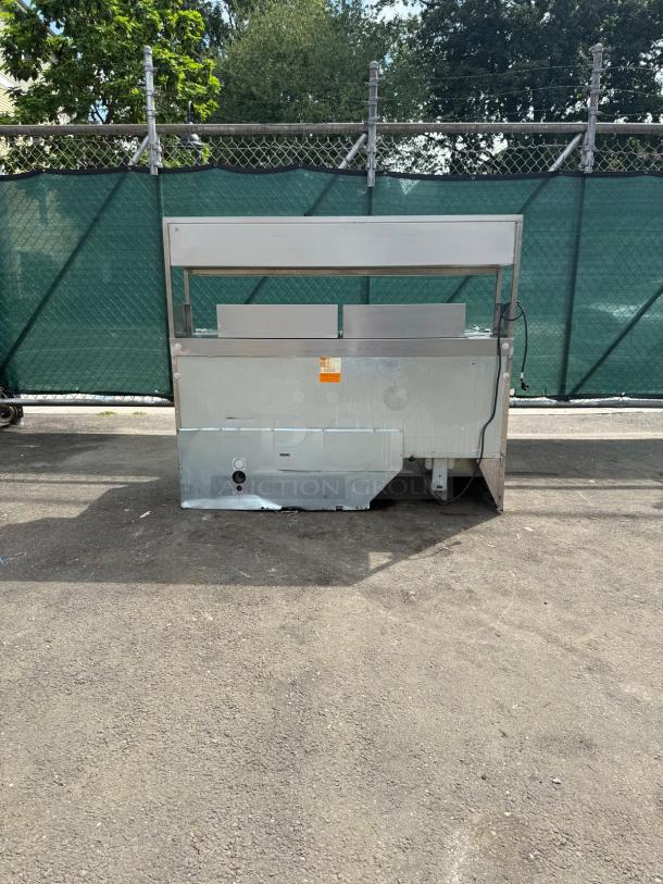 Delfield D4464NP refrigerated sandwich prep table with 4 drawers and 5" casters, in used condition.