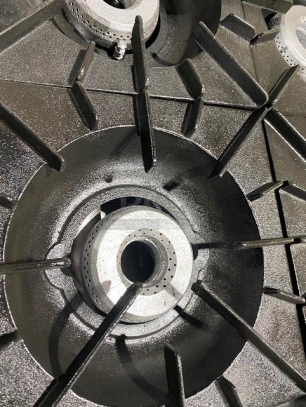 Vulcan commercial stainless steel range close-up, showing one of ten natural gas burners with cast iron grates.