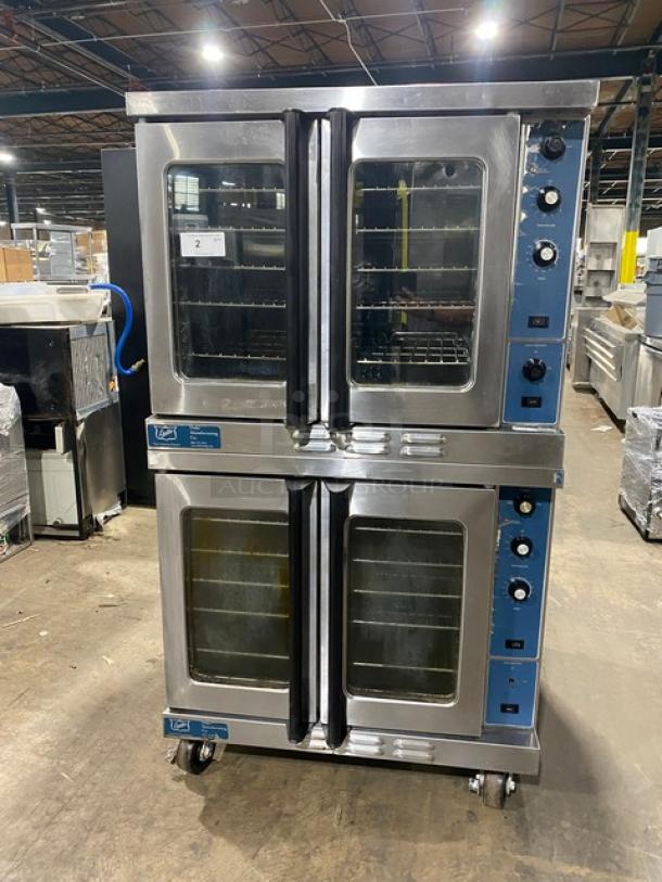 Duke Manufacturing stainless steel double-stacked convection oven, natural gas, thermostatic controls, wired racks, casters.